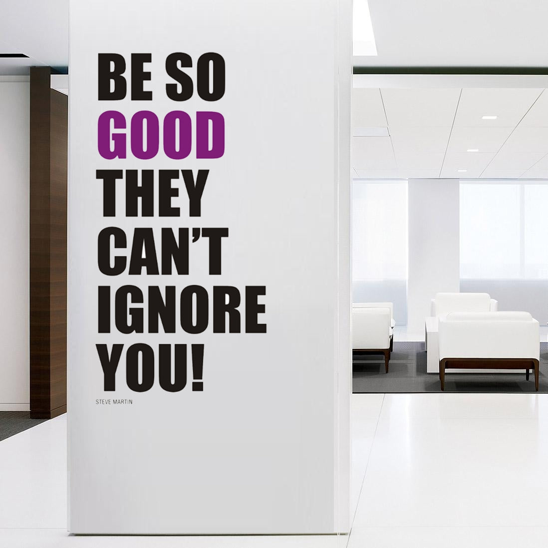 Motivational poster with text 'Be so good they can't ignore you!' in a modern office setting.