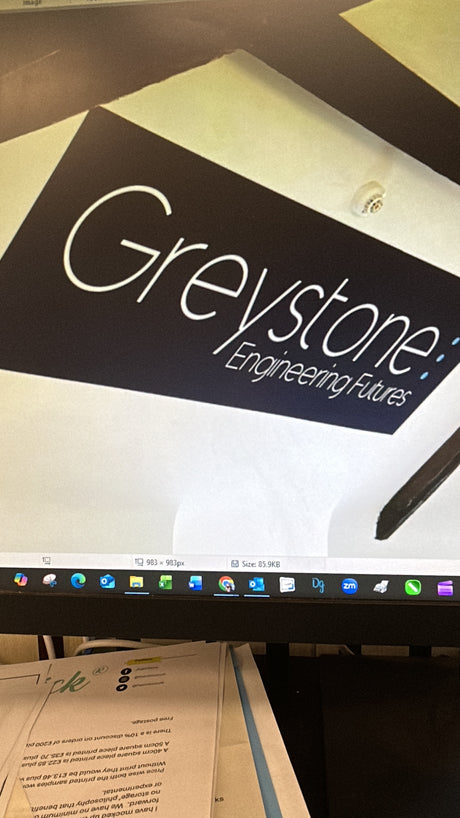 Computer screen with Greystone Engineering logo on a monitor