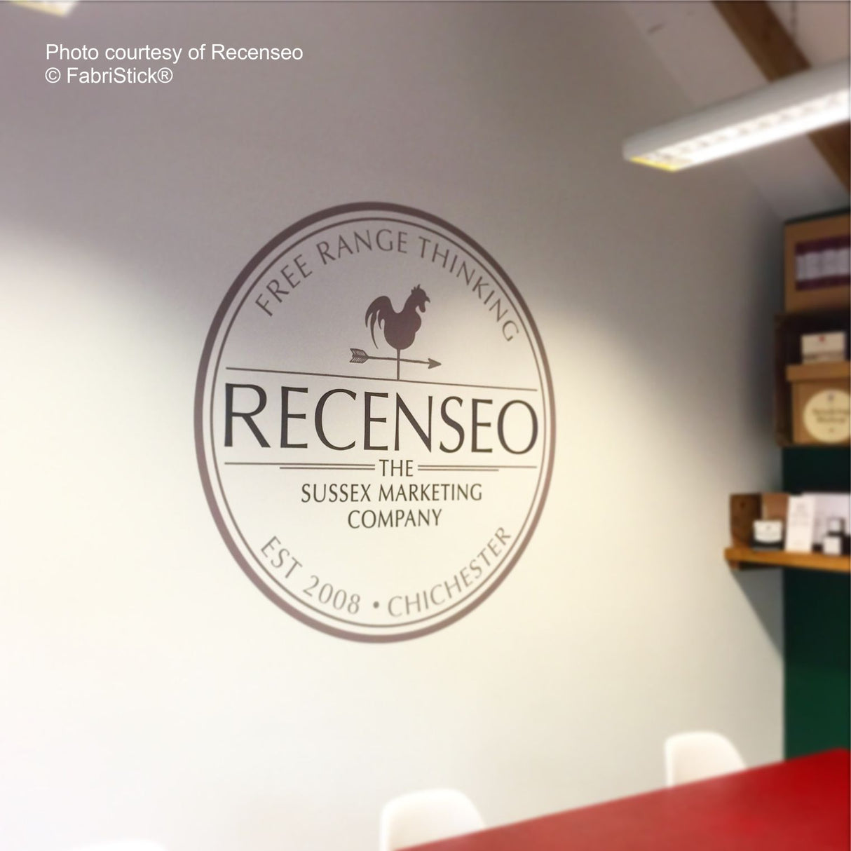 Recenseo logo on a wall in an office setting