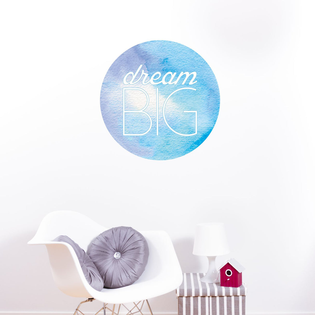 Decorative wall sticker with 'dream BIG' text on a white wall.