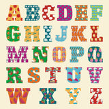 Colorful alphabet letters on a beige background