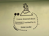 Motivational quote from Estée Lauder with a silhouette of a person on top of a mountain.