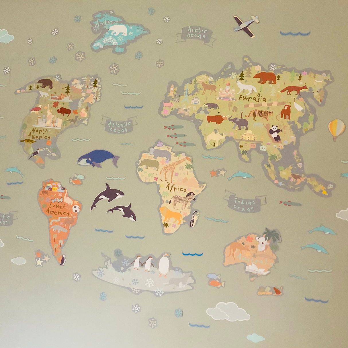 Children's world map with animals on a beige background