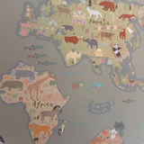 Children's world map with animals and landmarks on a gray background