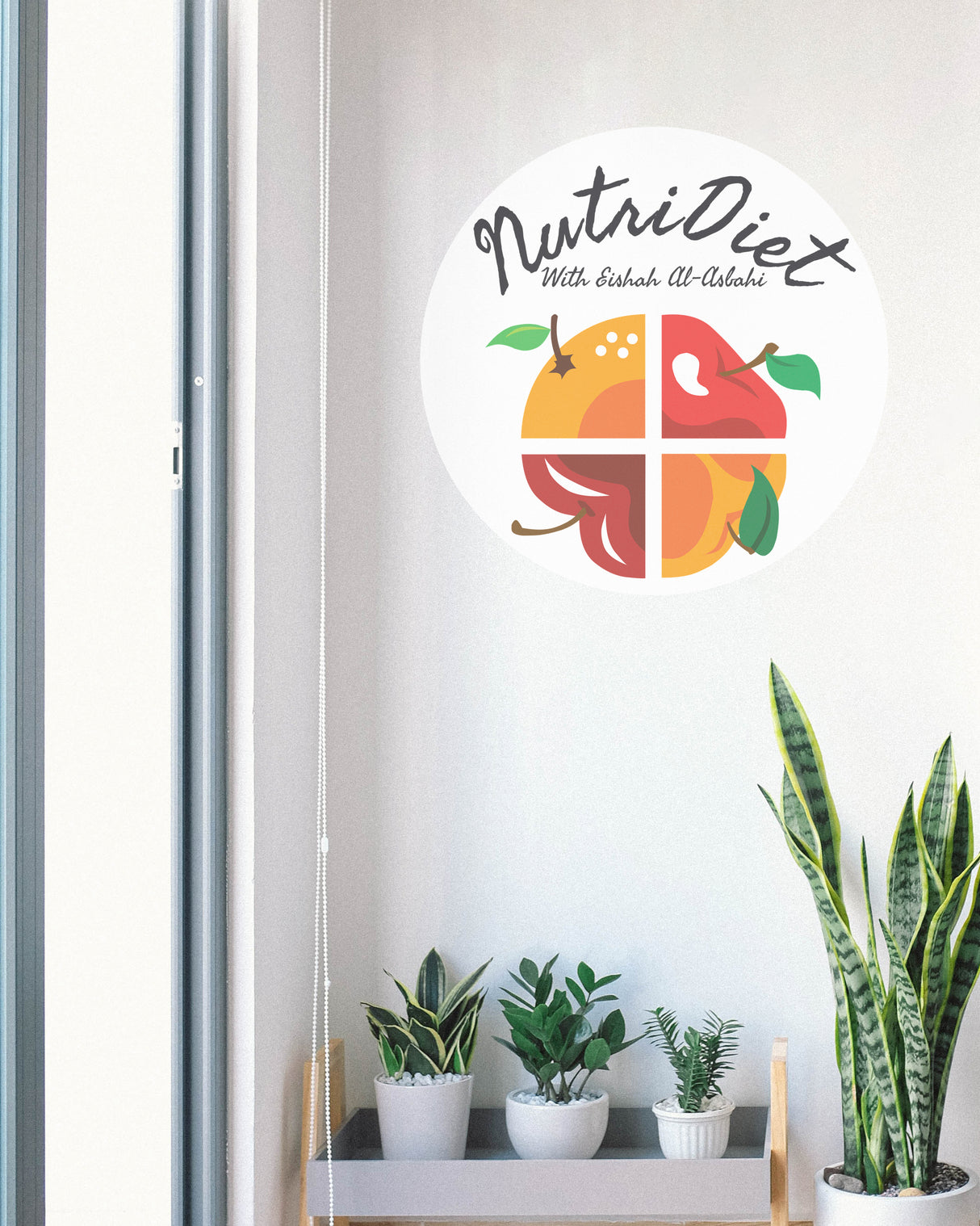 NutriDiet logo with fruits on a white wall above a shelf with plants.
