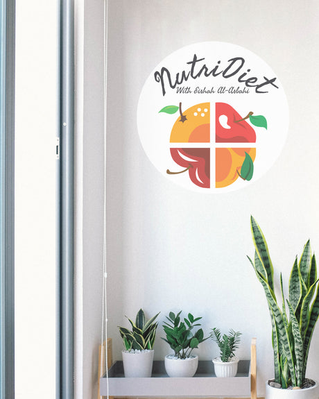 NutriDiet logo with fruits on a white wall above a shelf with plants.