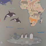 Map of Africa with cartoon animals on a gray background