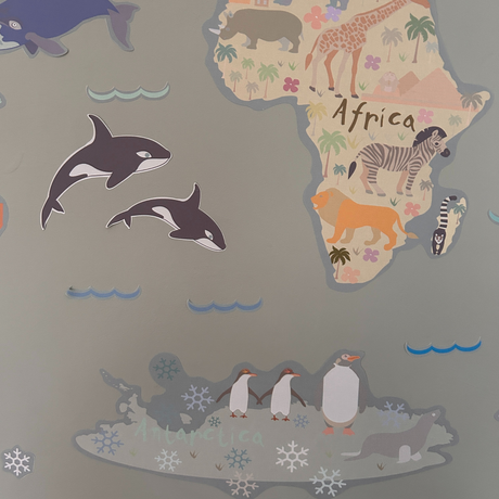 Map of Africa with cartoon animals on a gray background