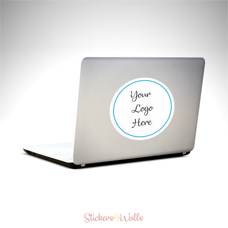 Laptop with a customizable sticker on a white background, featuring 'Your Logo Here' text.